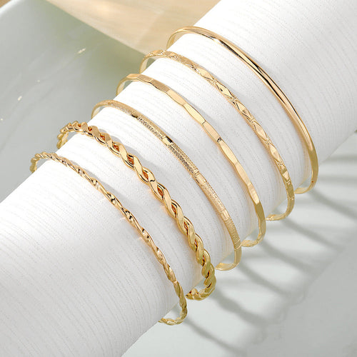 Golden Essence™ Stacking Bracelet Set – 7-Piece Luxury Gold Bangles